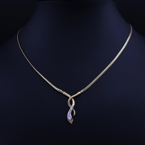 74 - A 9CT YELLOW GOLD SNAKE PENDANT NECKLACE, set with six graduated round brilliant cut diamonds, snake... 