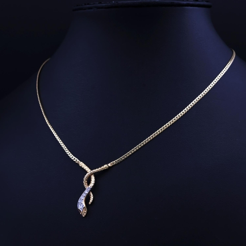 74 - A 9CT YELLOW GOLD SNAKE PENDANT NECKLACE, set with six graduated round brilliant cut diamonds, snake... 