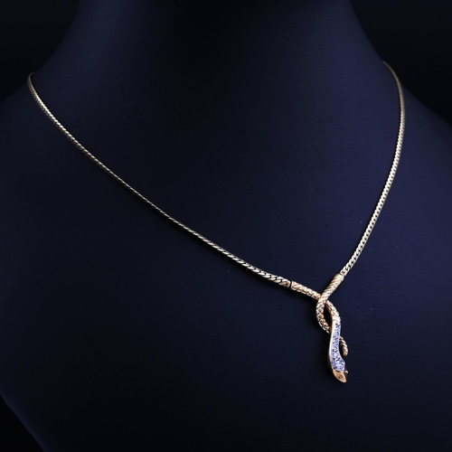 74 - A 9CT YELLOW GOLD SNAKE PENDANT NECKLACE, set with six graduated round brilliant cut diamonds, snake... 