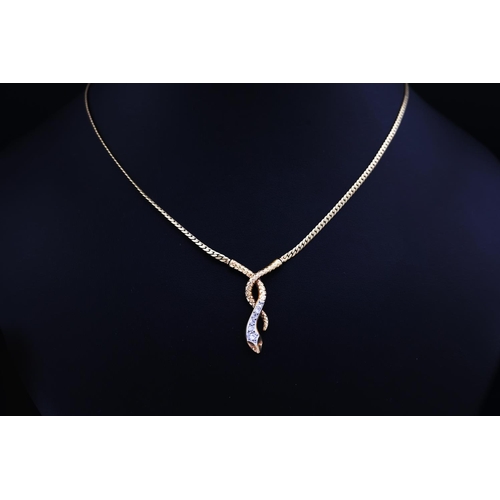 74 - A 9CT YELLOW GOLD SNAKE PENDANT NECKLACE, set with six graduated round brilliant cut diamonds, snake... 