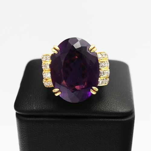 75 - AN 18CT GOLD AMETHYST AND DIAMOND RING AND EARRING SET, the clip-on earrings each set with a large o... 