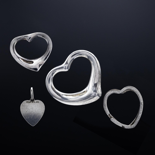 79 - A TIFFANY STERLING SILVER HEART SHAPED PENDANT, a solid heart shaped miniature pendant, a Tiffany ke... 