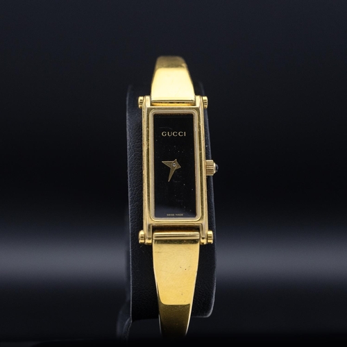 8 - GUCCI HORSEBIT LADIES BRACELET WATCH, 1500L, Swiss made, gold tone stainless steel with black face a... 