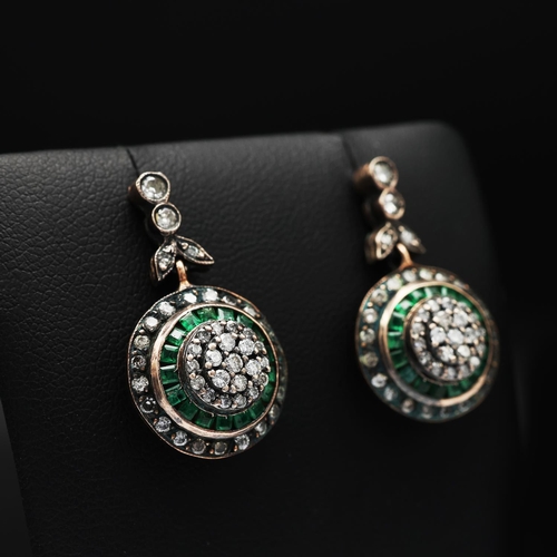 91 - A PAIR OF EMERALD AND DIAMOND PENDANT EARRINGS, rose yellow metal backs, each with a cluster of diam... 