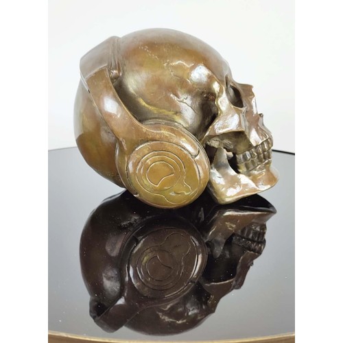 364 - CONTEMPORARY SCHOOL DJ SKULL, cast metal, 18cm H x 18cm W.