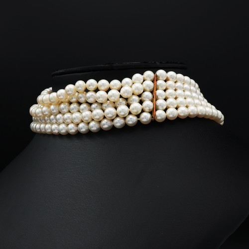 85 - A FIVE STRAND CULTURED PEARL CHOKER NECKLACE, having approximately 249 round 7mm pearls, yellow meta... 