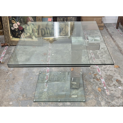 304 - GLASS DINING TABLE, swivel glass top extending 90cm D x 180cm fully extended.