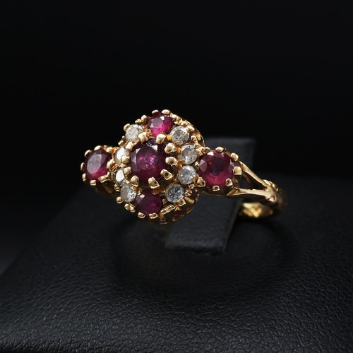 110 - AN 18CT YELLOW GOLD RUBY AND DIAMOND DRESS RING, set with five mixed cut rubies interspaced with eig... 