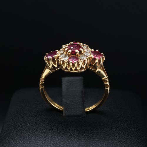 110 - AN 18CT YELLOW GOLD RUBY AND DIAMOND DRESS RING, set with five mixed cut rubies interspaced with eig... 