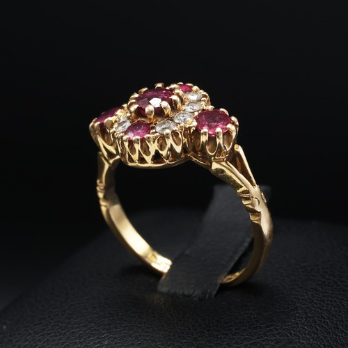 110 - AN 18CT YELLOW GOLD RUBY AND DIAMOND DRESS RING, set with five mixed cut rubies interspaced with eig... 