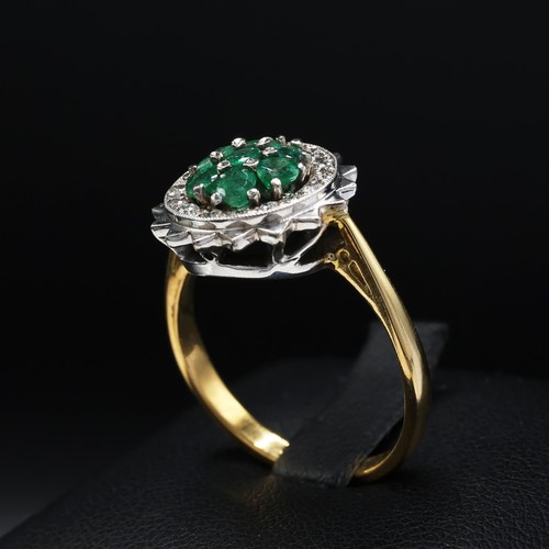 111 - AN 18CT GOLD EMERALD AND DIAMOND DRESS RING, mid 20th century, the platinum open backed setting with... 