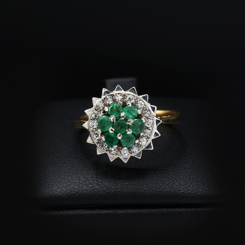 111 - AN 18CT GOLD EMERALD AND DIAMOND DRESS RING, mid 20th century, the platinum open backed setting with... 