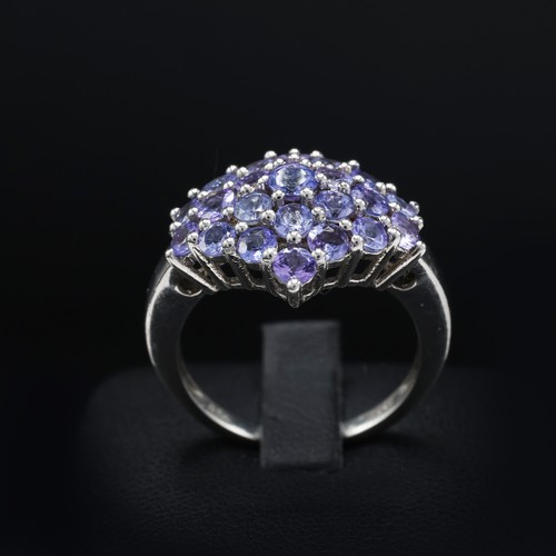 112 - A 9CT GOLD TANZANITE CLUSTER RING, set with 19 round mixed cut tanzanites, ring size K½, together wi... 