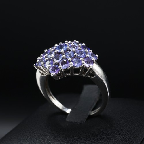 112 - A 9CT GOLD TANZANITE CLUSTER RING, set with 19 round mixed cut tanzanites, ring size K½, together wi... 