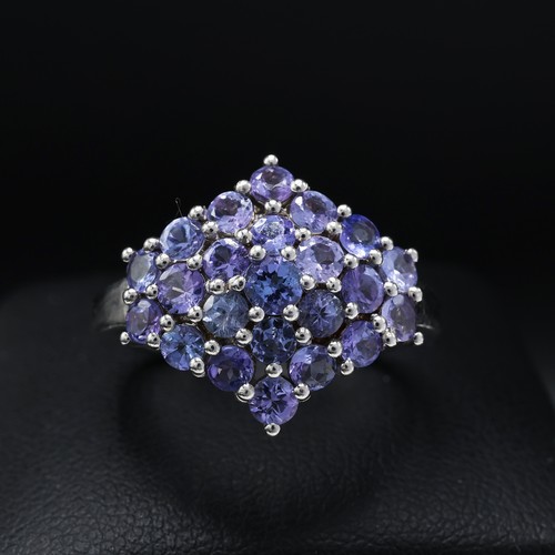 112 - A 9CT GOLD TANZANITE CLUSTER RING, set with 19 round mixed cut tanzanites, ring size K½, together wi... 