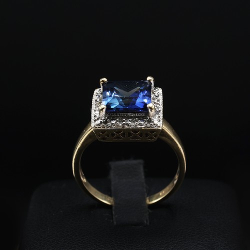 69 - A 9CT GOLD SAPPHIRE AND DIAMOND SET DRESS RING, the central square cut sapphire with a marcasite sur... 