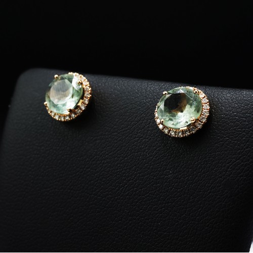 67 - A PAIR OF 18CT GOLD TOPAZ AND DIAMOND STUD EARRINGS, each with round mixed cut topaz, surrounded by ... 