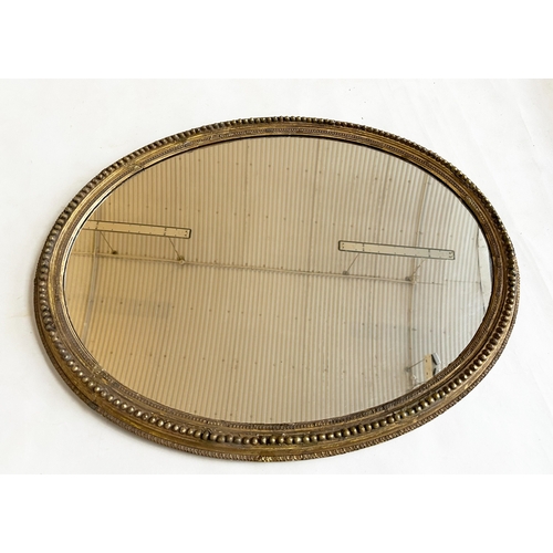 544 - WALL MIRROR, 19th century giltwood and gesso oval with beaded frame, 74cm H x 57cm W.