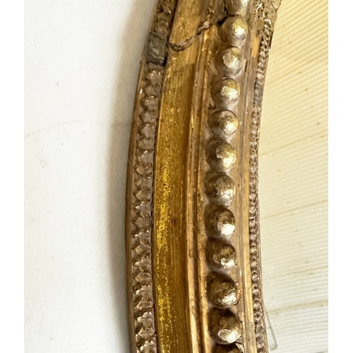 544 - WALL MIRROR, 19th century giltwood and gesso oval with beaded frame, 74cm H x 57cm W.