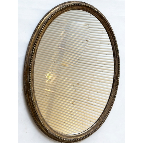 544 - WALL MIRROR, 19th century giltwood and gesso oval with beaded frame, 74cm H x 57cm W.