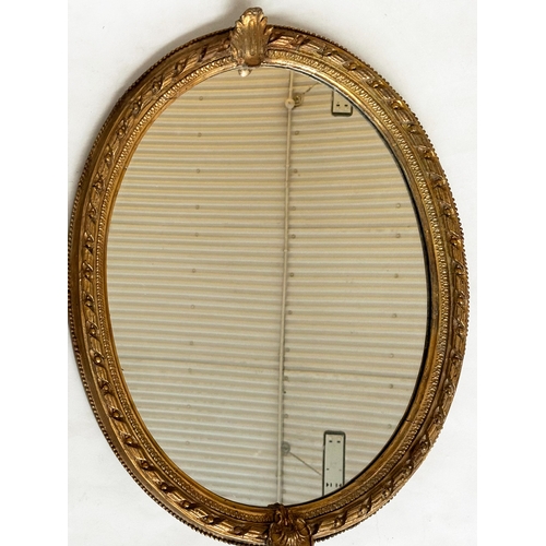 547 - WALL MIRROR, 19th century giltwood and gesso with oval beaded frame with foliate crest and base, 81c... 