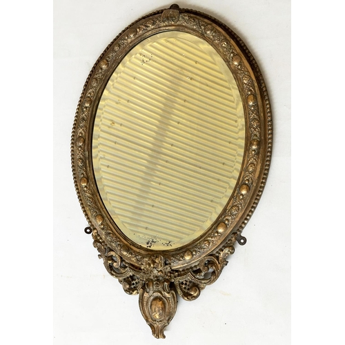 541 - WALL MIRROR, 19th century giltwood and gesso oval bevelled mirror with shield shaped base, 60cm W x ... 