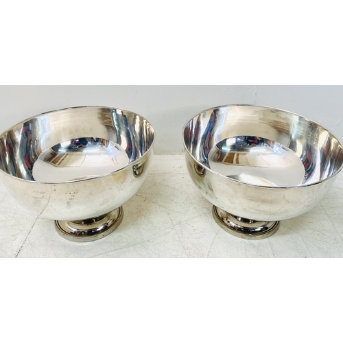 315 - PUNCH BOWLS, a pair, Regency style, polished metal. (2)