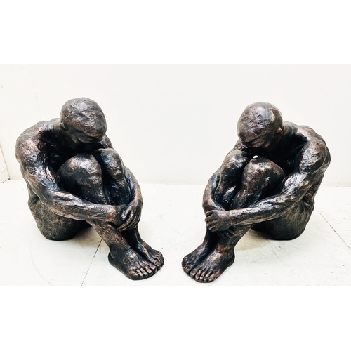 318 - CONTEMPORARY SITTING MAN SCULPTURES, a pair, resin, 34cm H x 21cm W x 40cm D. (2)