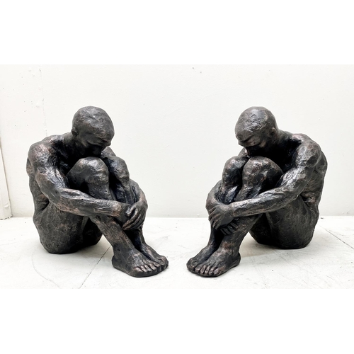 318 - CONTEMPORARY SITTING MAN SCULPTURES, a pair, resin, 34cm H x 21cm W x 40cm D. (2)