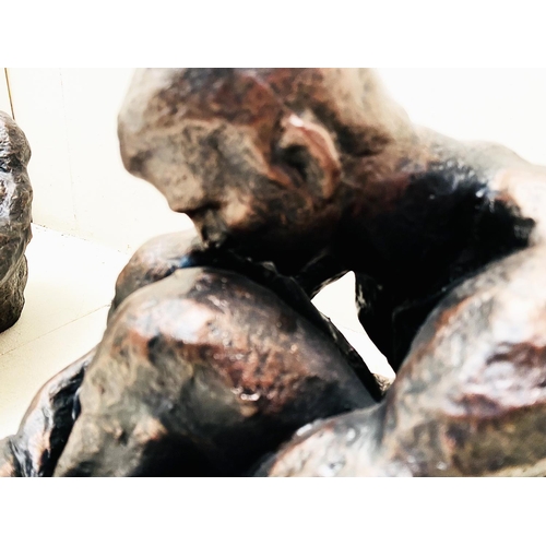 318 - CONTEMPORARY SITTING MAN SCULPTURES, a pair, resin, 34cm H x 21cm W x 40cm D. (2)