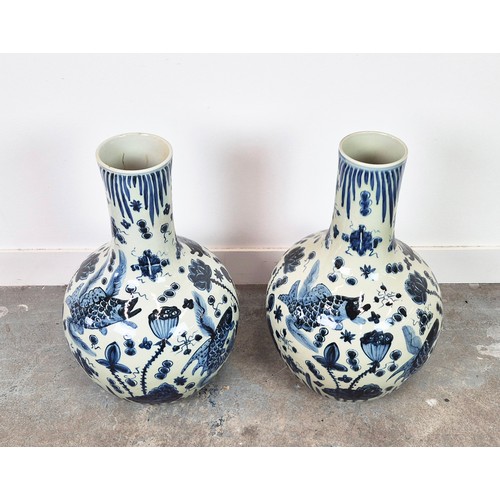 431 - BOTTLE VASES, a pair, Chinese style blue and white ceramic, 59cm H approx. (2)