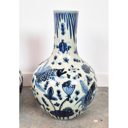 431 - BOTTLE VASES, a pair, Chinese style blue and white ceramic, 59cm H approx. (2)