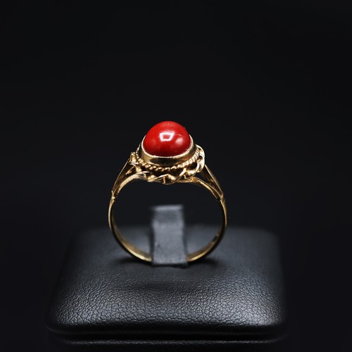 68 - A 9CT GOLD CORAL SET CABOCHON DRESS RING, ring size Q, together with an 18ct gold wedding band, ring... 