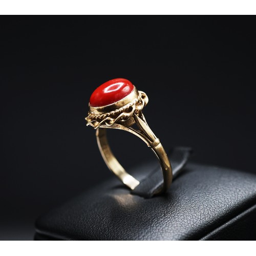 68 - A 9CT GOLD CORAL SET CABOCHON DRESS RING, ring size Q, together with an 18ct gold wedding band, ring... 