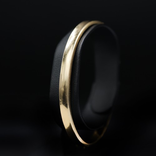 127 - A 14CT YELLOW GOLD BANGLE, 9 grams