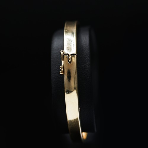 127 - A 14CT YELLOW GOLD BANGLE, 9 grams