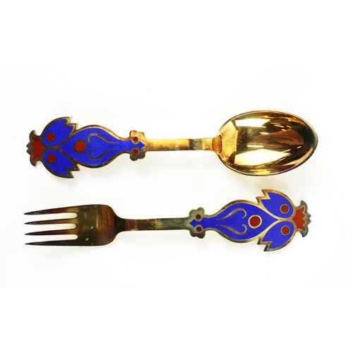 44 - GEORG JENSEN STERLING SILVER GOLD PLATED SPOONS, 13 with flower motif enamel inlay and late 20th cen... 