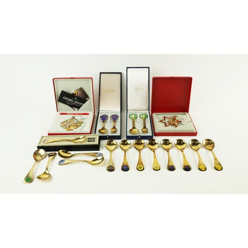 44 - GEORG JENSEN STERLING SILVER GOLD PLATED SPOONS, 13 with flower motif enamel inlay and late 20th cen... 