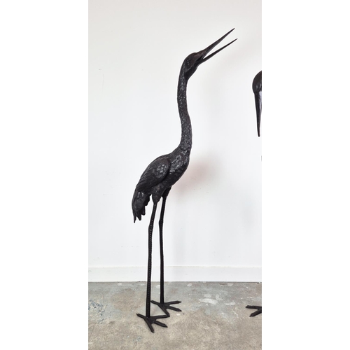 386 - CRANE SCULPTURES, a set of two, cast metal, 162cm H x 23cm W x 50cm D. (2)