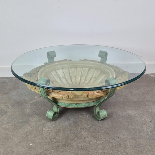 540 - LOW TABLE, Hollywood Regency style, glass oval top, wooden and scrolled metal frame, in oxidized fin... 