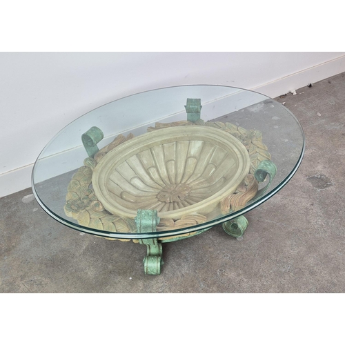 540 - LOW TABLE, Hollywood Regency style, glass oval top, wooden and scrolled metal frame, in oxidized fin... 