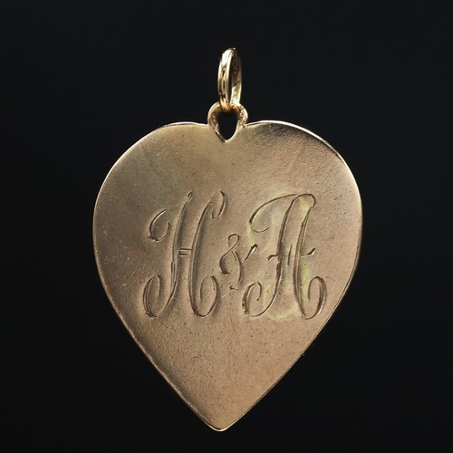 48 - A COLLECTION OF 9CT GOLD, comprising two pendants with inscribed initials, a yellow metal inscribed ... 