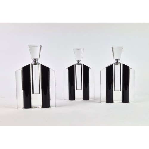 106 - A SET OF THREE ART DECO STYLE GLASS PERFUME BOTTLES, in clear and black glass, each measuring 24.5cm... 