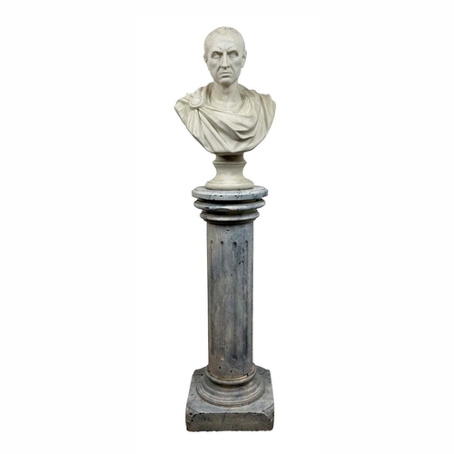 593 - BUST OF JULIUS CAESAR, 20th century plaster on a 19th century faux marble painted stand, bust 60cm H... 