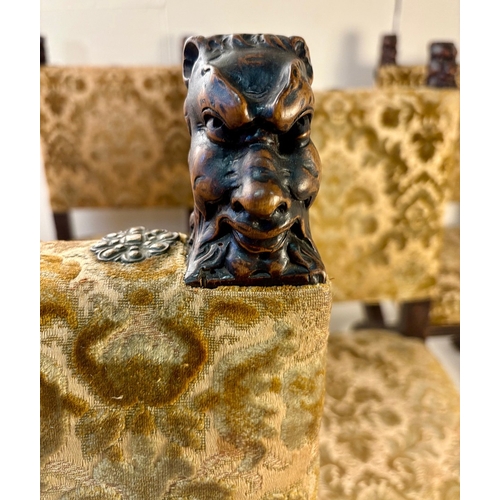 242 - SET OF SIX GOTHIC STYLE EBONISED WALNUT DINING CHAIRS. Late 19th century Continental, with carved he... 