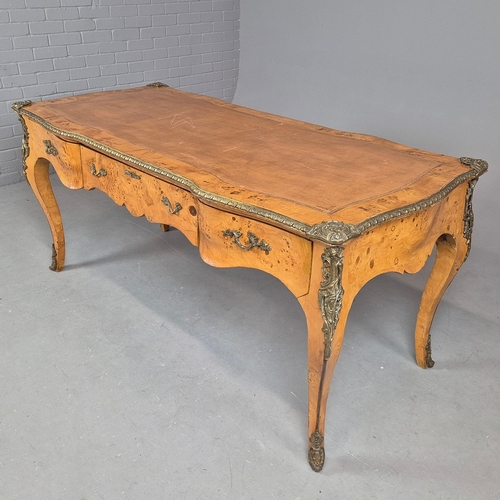 269 - LOUIS XV STYLE BURR VENEERED AND BRASS MOUNTED BUREAU PLAT. tan leather top above three drawers, 82c... 