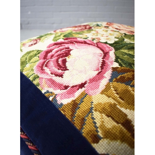 288 - NEEDLEWORK AND BLUE VELVET POUFFE. in the form of stacked cushions on castors, 41cm H 58cm W x 58cm ... 