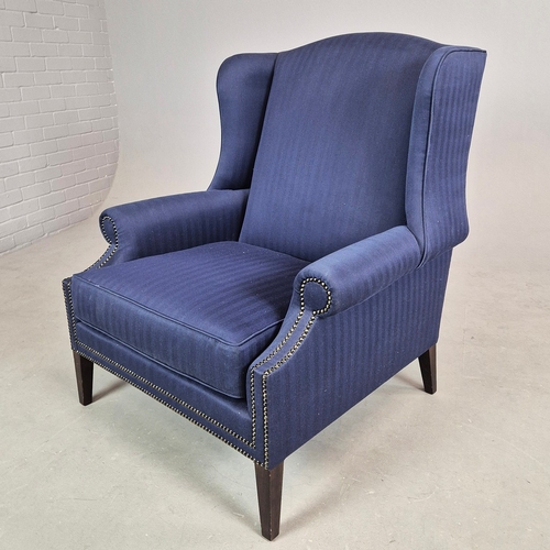 310 - WINGBACK CHAIR AND FOOTSTOOL (2). in blue herringbone fabric 76cm w x 103cm t and a small footstool ... 