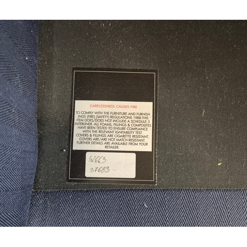 310 - WINGBACK CHAIR AND FOOTSTOOL (2). in blue herringbone fabric 76cm w x 103cm t and a small footstool ... 