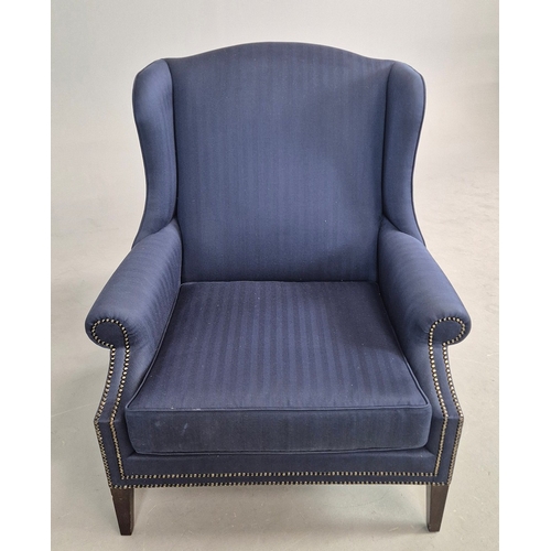 310 - WINGBACK CHAIR AND FOOTSTOOL (2). in blue herringbone fabric 76cm w x 103cm t and a small footstool ... 